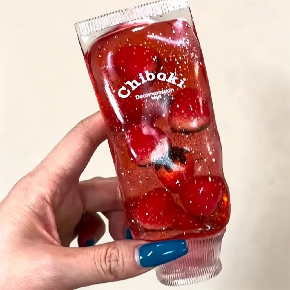 Hand drückt Jelly Kristall Tube zusammen